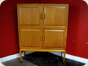 Swedish 50's 4 door
cabinet with shelves, moulded drawers and
sculptural handles, made by Bodafors