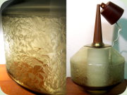 Taklampa med innerkupa i opalinglas och
                          ytterkupa i mönstrat, brunt glas, upphängning
                          och takkopp i teak