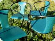 4 black lacquered metal and teal vinyl
                          chairs