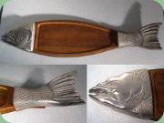 Fish shaped teak cutting
                        board with white metal details