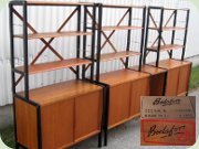 Swedish design 50's or
                          60's teak bookshelves with sliding door
                          cabinets and black lacquered sides, Bodafors
                          Bertil Fridhagen