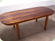 Rosewood veneer dining
                          table with rounded corners