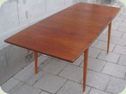 60's teak dining table
                          with extension leaves.