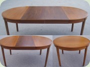 Round walnut veneered
                          dining table with extension leaves