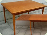 Scandinavian 60's teak
                          veneer dning table with Dutch leaves