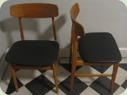 Swedish 50's or 60's
                          teak & beech dining chairs, re-upholstered
                          in black vinyl