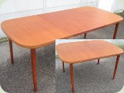Teak dining table with
                          extension leaves