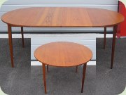 50's or 60's round
                          teak dining table with extension leaves