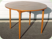 50's teak neat round
                          dining table with one leaf