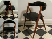 Scandinavian 50's teak
                          side chair with tapered legs upholstered in
                          black vinyl