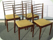 Four elegant stained
                          birch chairs