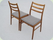 Four teak/teak stained
                          beech dining chairs