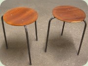 Three legged teak
                          stools with black lacquered legs