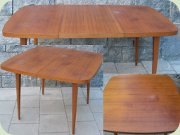 Swedish 50's or 60's
                          teak veneer square dining table with rounded
                          corners and one extension leaf