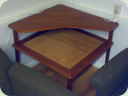 Danish designed teak
                          corner table Minerva / Attrance with wicke
                          magazine shelf, Hvidt/Mölgaard-Nielsen, France
                          & Son