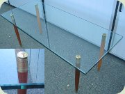 Swedish 60's glass
                          coffee table with teak legs