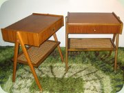 A pair of Swedish 50's
                          or 60's teak bedside tables with drawer and
                          rattan magazine shelf