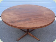 60's or 70's round
                          rosewood laminated coffee table on pedestal
                          base