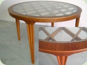 Swedish 50's round
                          glass top coffee table