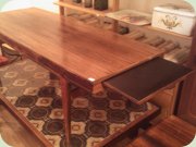 Rosewood coffee table
                          with extension leaves in black formica