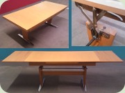 50's coffee table on
                          aluminum shaker legs with adjustable height
                          and extension leaves for use as dining table,
                          probably made in Germany.