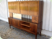 Danish 50's large
                          highboard with tambour doors, drawers and
                          sliding glass doors, labeled Holger
                          Christensen's Mobelmagasiner