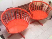 Red, wooden
                          swivelchairs, probably by Edsbyverken